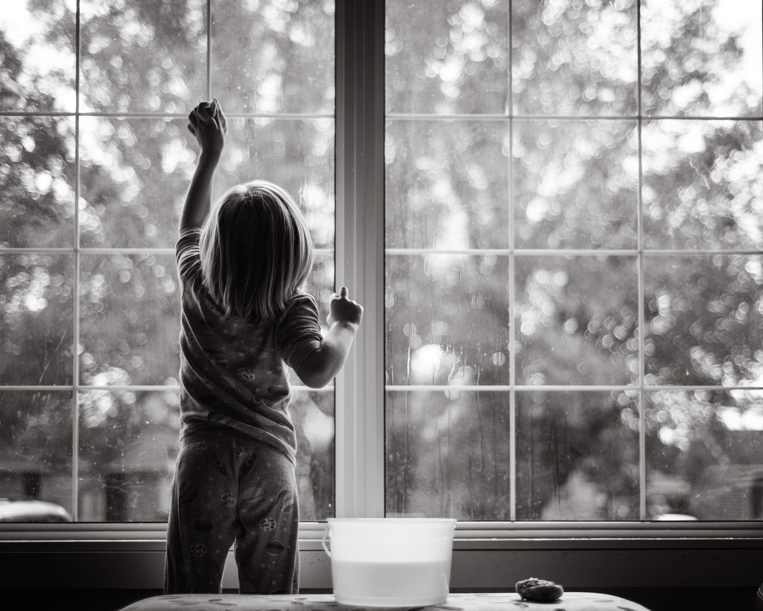 kid cleaning the window